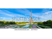 Stock-photo-eiffel-tower-panorama-with-cloudy-blue-sky-and-surrounding-park-22775017.jpg