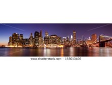 Stock-photo-new-york-panoramic-view-of-manhattan-skyline-by-night-165013406.jpg