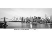 Stock-photo-new-york-city-skyline-with-brooklyn-bridge-and-lower-manhattan-view-in-early-morning-sun-light-111777137.jpg