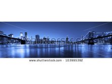 Stock-photo-view-of-manhattan-and-brooklyn-bridges-and-skyline-at-night-103995392.jpg
