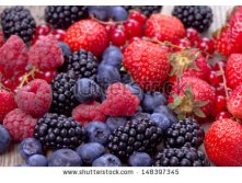 Stock-photo-mixed-berries-over-wooden-background-148397345.jpg