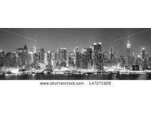 Stock-photo-new-york-city-manhattan-midtown-skyline-black-and-white-at-night-with-skyscrapers-lit-over-hudson-147271928.jpg