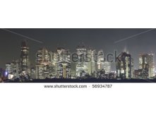 Stock-photo-tokyo-at-night-panorama-with-illuminated-skyscrapers-56934787.jpg