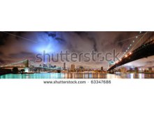 Stock-photo-new-york-city-manhattan-panorama-view-with-brooklyn-bridge-and-manhattan-bridge-at-night-with-63347686.jpg