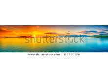 Stock-photo-sunrise-over-the-sea-panorama-129390128.jpg