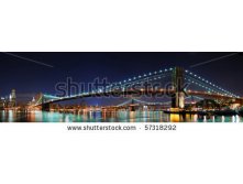 Stock-photo-new-york-city-manhattan-skyline-panorama-with-brooklyn-bridge-and-office-skyscrapers-building-in-at-57318292.jpg