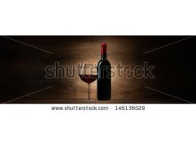 Stock-photo-green-bottle-with-red-wine-and-glass-on-a-wood-panorama-background-146136029.jpg