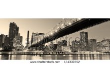 Stock-photo-queensboro-bridge-over-new-york-city-east-river-black-and-white-at-night-with-river-reflections-and-184337852.jpg