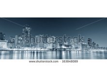 Stock-photo-new-york-city-manhattan-midtown-skyline-black-and-white-at-night-over-east-river-163848089.jpg