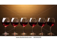 Stock-photo-wineglasses-on-brown-background-98589299.jpg