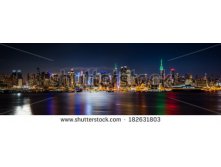 Stock-photo-new-york-skyline-panorama-by-night-taken-in-front-of-the-nd-street-canyon-empire-state-building-182631803.jpg