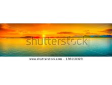 Stock-photo-sunrise-over-the-sea-panorama-136119323.jpg