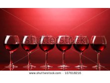 Stock-photo-wineglasses-on-red-background-107618216.jpg