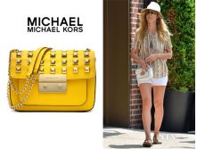 181800561-heidi-klums-michael-michael-kors-sloan-pyramid-stud-saffiano-flap-bag.jpg