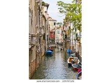 stock-photo-beautiful-view-of-traditional-venetian-buildings-along-a-water-channel-venice-italy-europe-105767129.jpg