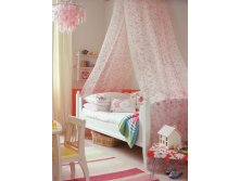 cozy-girl-bedroom-with-high-canopy-draped-over-a-bed.jpg