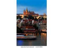 stock-photo-prague-castle-with-surrounding-buildings-across-vltava-river-in-the-evening-111873806.jpg