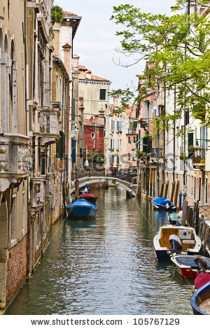 stock-photo-beautiful-view-of-traditional-venetian-buildings-along-a-water-channel-venice-italy-europe-105767129.jpg