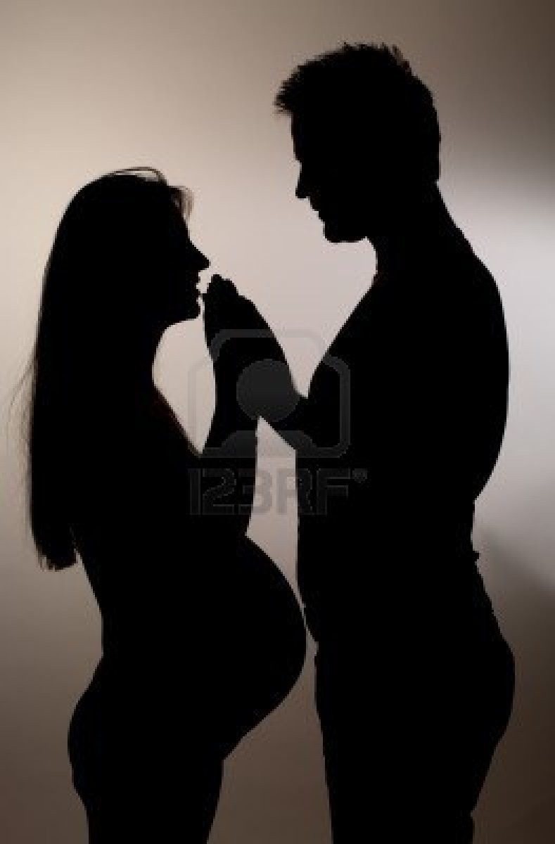 8149701-pregnant-couple-silhouette-on-grey-gradient-background.jpg