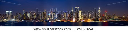 Stock-photo-manhattan-skyline-panorama-with-times-square-lights-at-dusk-new-york-city-129023246.jpg