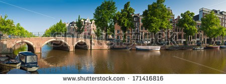 Stock-photo-pretty-dutch-doll-houses-and-house-boats-reflected-in-the-tranquil-canals-of-amsterdam-holland-171416816.jpg