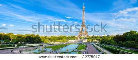 Stock-photo-eiffel-tower-panorama-with-cloudy-blue-sky-and-surrounding-park-22775017.jpg