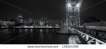 Stock-photo-black-and-white-panorama-of-tower-bridge-and-tower-prison-in-london-capital-of-the-uk-at-night-139104389.jpg