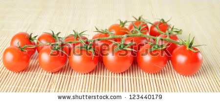 Stock-photo-panorama-of-fresh-cherry-tomatoes-on-bamboo-background-123440179.jpg