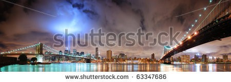 Stock-photo-new-york-city-manhattan-panorama-view-with-brooklyn-bridge-and-manhattan-bridge-at-night-with-63347686.jpg