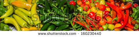 Stock-photo-a-bulk-display-of-colorful-hot-peppers-ready-for-use-in-the-kitchen-160230440.jpg