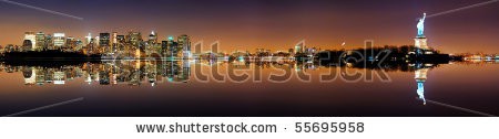 Stock-photo-manhattan-new-york-city-skyline-with-statue-of-liberty-at-night-with-reflection-55695958.jpg