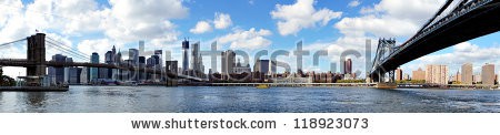 Stock-photo-panoramic-view-of-manhattan-with-brooklyn-bridge-and-manhattan-bridge-seen-from-brooklyn-bridge-118923073.jpg