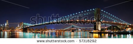 Stock-photo-new-york-city-manhattan-skyline-panorama-with-brooklyn-bridge-and-office-skyscrapers-building-in-at-57318292.jpg