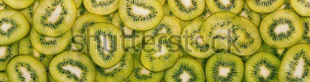 Stock-photo-panorama-of-juicy-sliced-kiwi-201792026.jpg