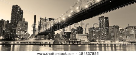 Stock-photo-queensboro-bridge-over-new-york-city-east-river-black-and-white-at-night-with-river-reflections-and-184337852.jpg