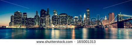 Stock-photo-new-york-panoramic-view-of-manhattan-skyline-by-night-165001313.jpg