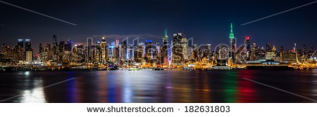 Stock-photo-new-york-skyline-panorama-by-night-taken-in-front-of-the-nd-street-canyon-empire-state-building-182631803.jpg