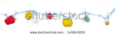 Stock-photo-tropical-fruits-and-vegetables-falling-into-water-with-splash-isolated-on-white-145843205.jpg