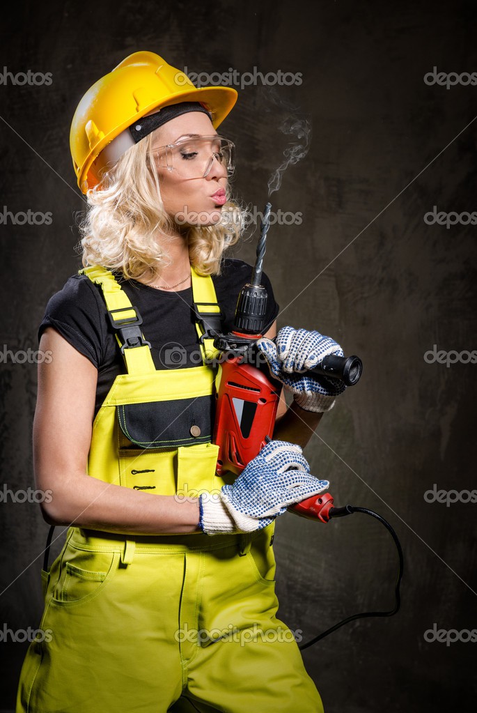 Depositphotos 26083159-Attractive-builder-woman-with-a.jpg