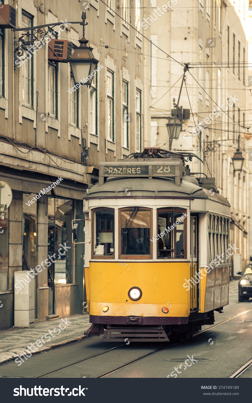 Stock-photo-vintage-tram-in-the-city-center-of-lisbon-portugal-374749189.jpg