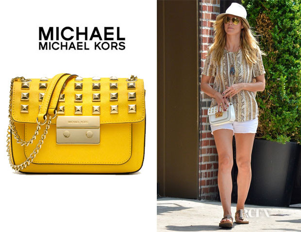 181800561-heidi-klums-michael-michael-kors-sloan-pyramid-stud-saffiano-flap-bag.jpg